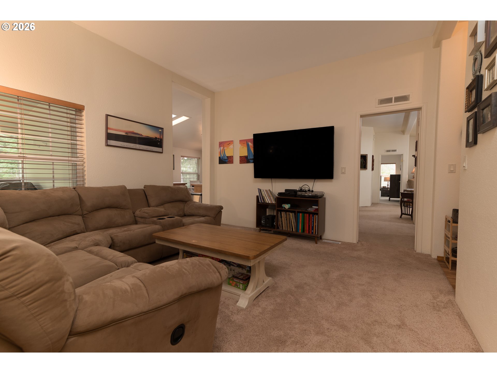 1157 8th Street Bandon, OR 97411 - Photo 12 of 46 a living room with furniture and a flat screen tv