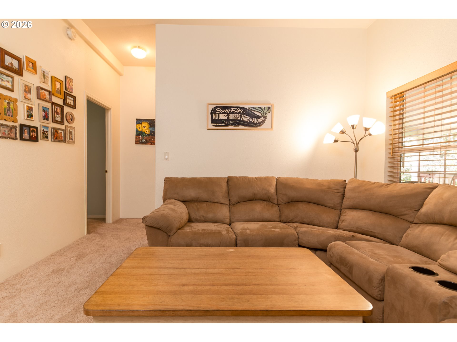 1157 8th Street Bandon, OR 97411 - Photo 14 of 46 a living room with furniture and a window