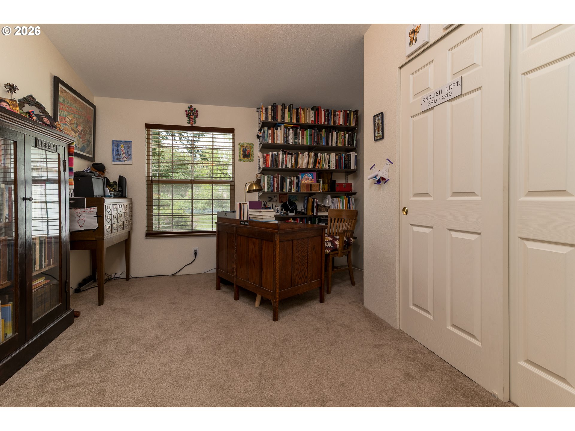 1157 8th Street Bandon, OR 97411 - Photo 19 of 46 a room with furniture and a book shelf
