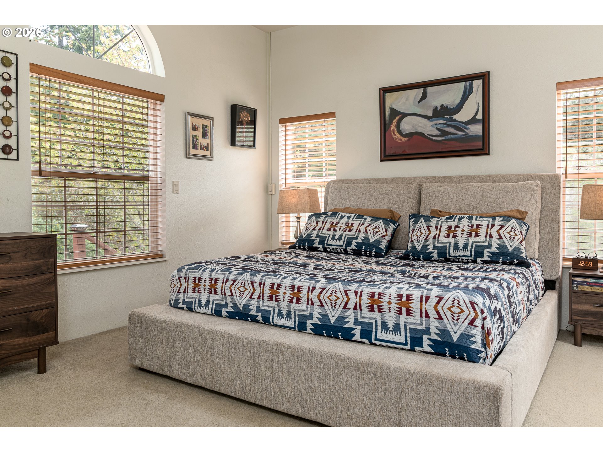 1157 8th Street Bandon, OR 97411 - Photo 22 of 46 a bedroom with a bed and a window