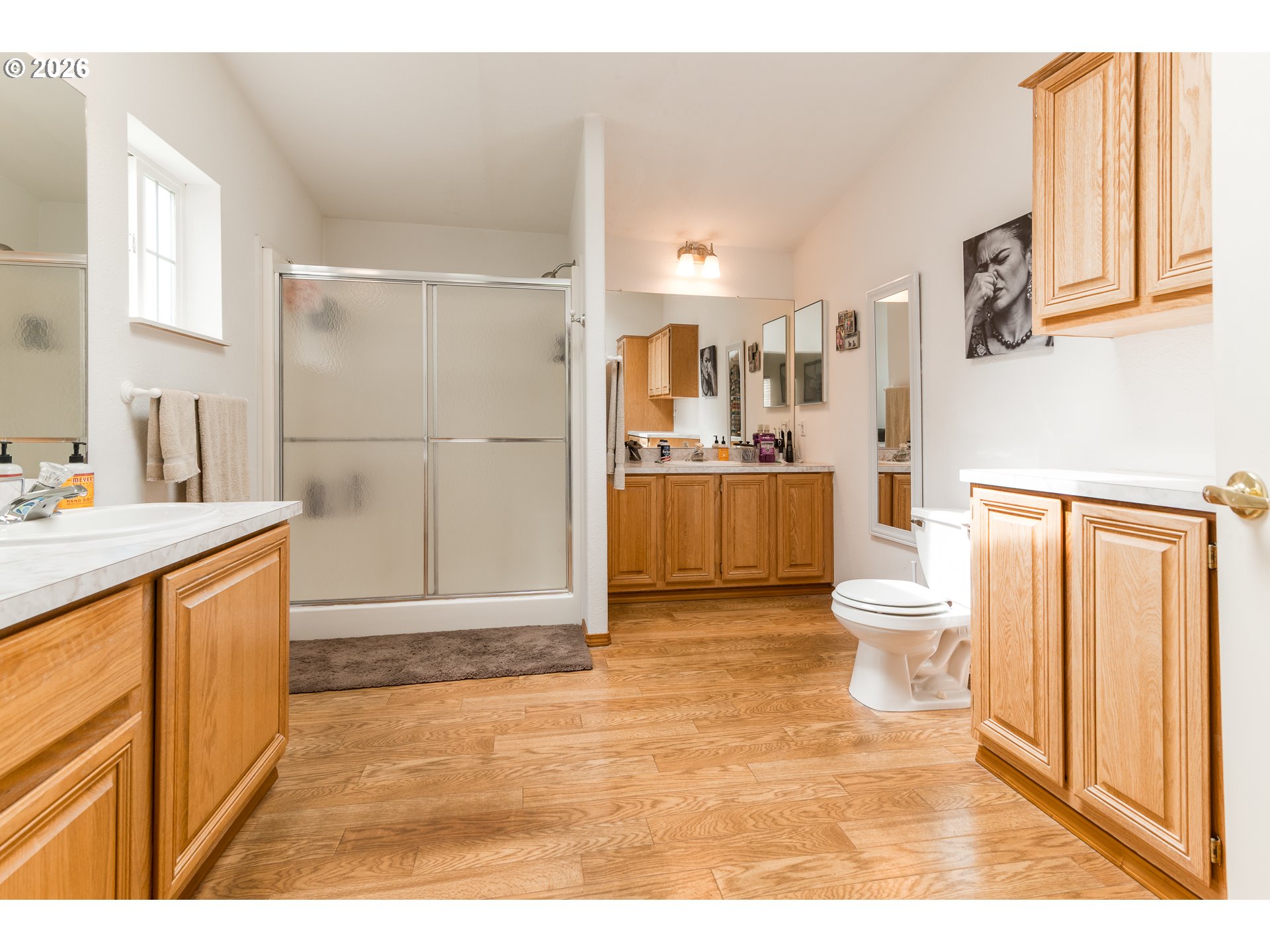 1157 8th Street Bandon, OR 97411 - Photo 24 of 46 a bathroom with a sink a toilet and a mirror