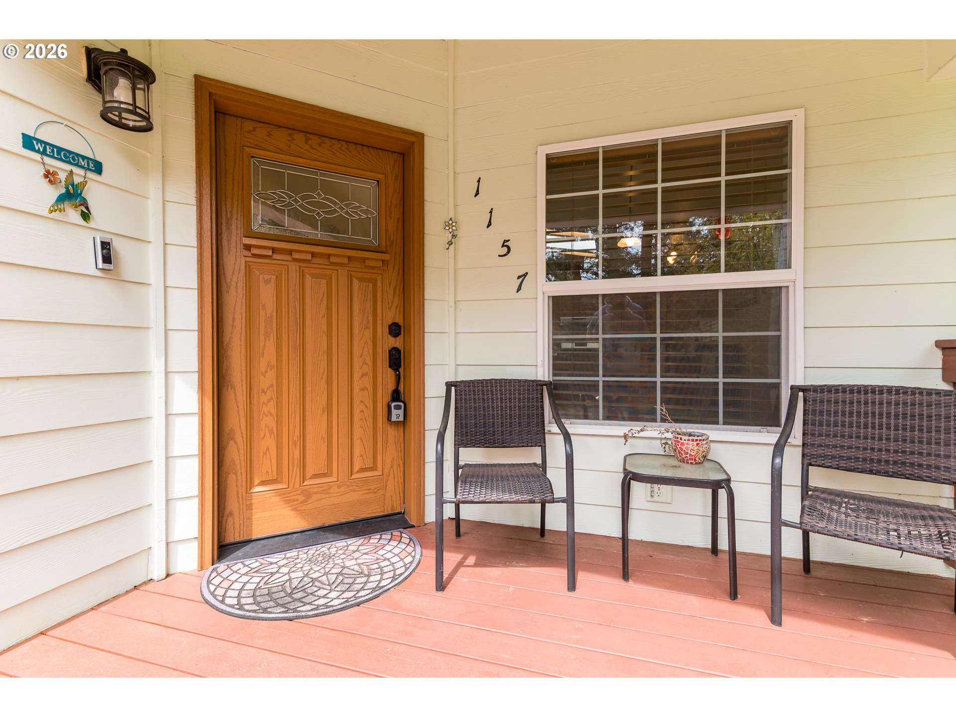 1157 8th Street Bandon, OR 97411 - Photo 25 of 46 a view of front door with outdoor seating