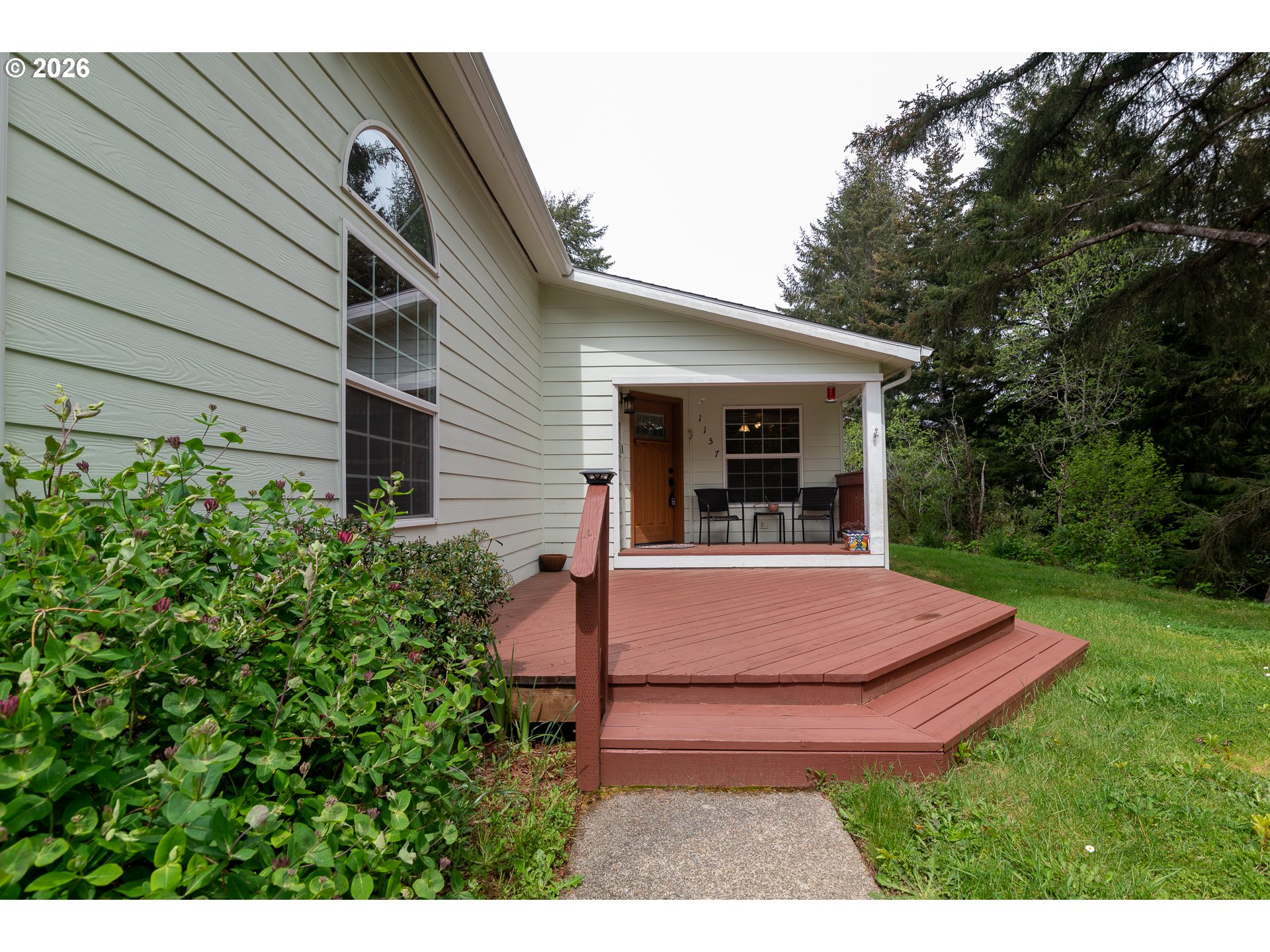 1157 8th Street Bandon, OR 97411 - Photo 39 of 46 a view of outdoor space yard and porch