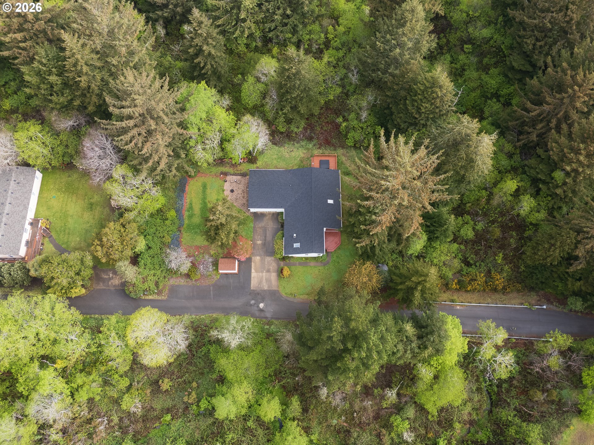 1157 8th Street Bandon, OR 97411 - Photo 40 of 46 an aerial view of a house with a yard