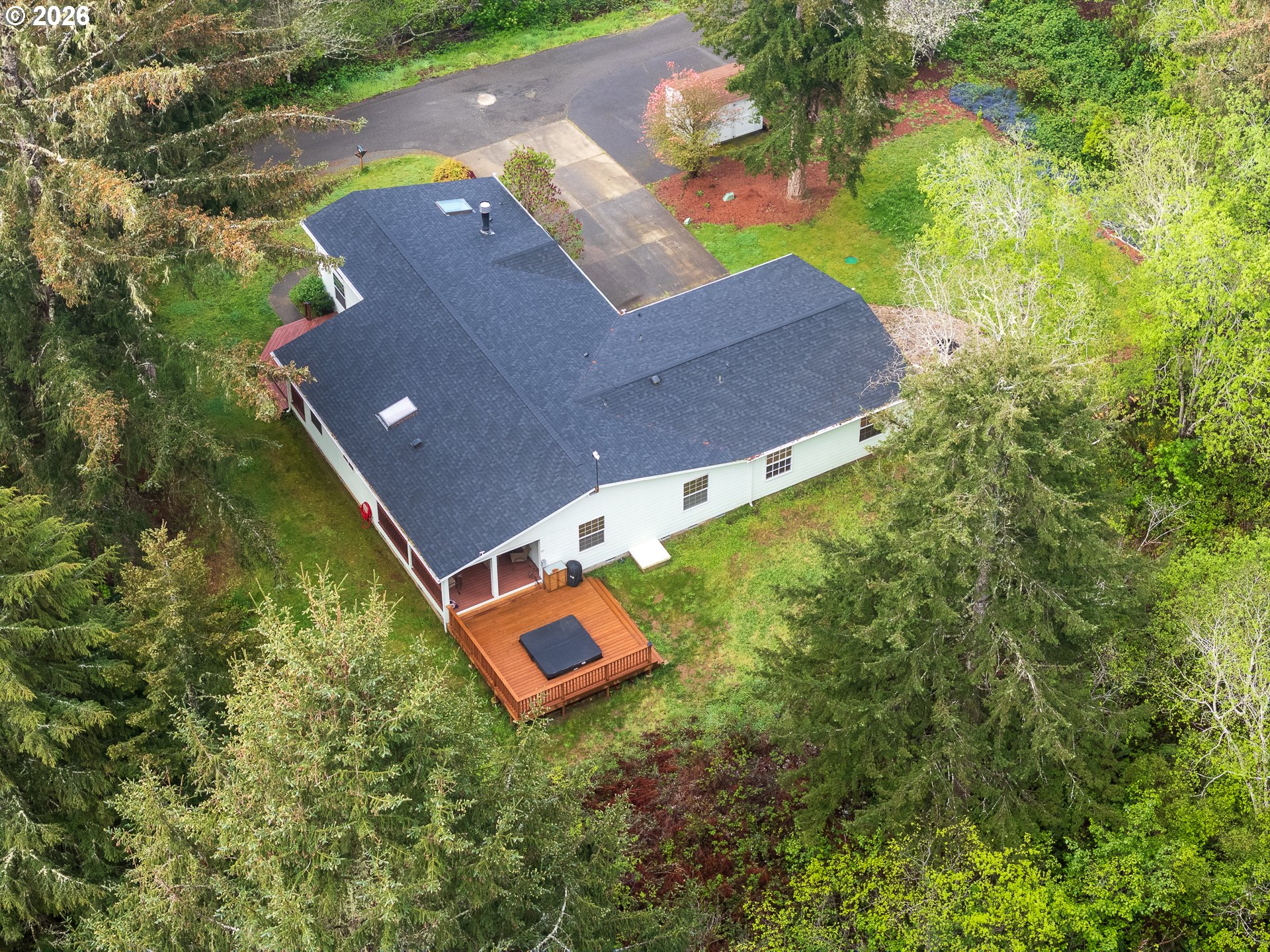 1157 8th Street Bandon, OR 97411 - Photo 45 of 46 an aerial view of a house with a yard