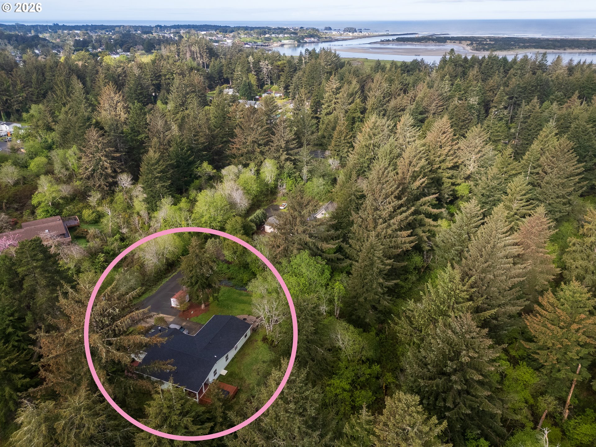 1157 8th Street Bandon, OR 97411 - Photo 5 of 46 an aerial view of a house with a yard and lake view
