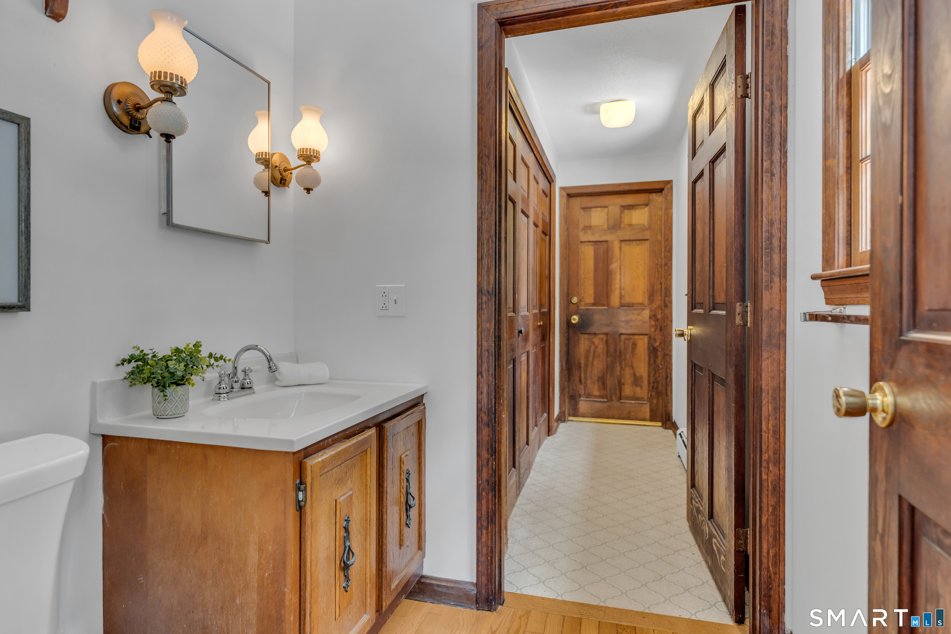 289 South Hoop Pole Road Guilford, CT 06437 - Photo 20 of 38 First Floor Half Bath - 2 Extra Large Closets -Door to Garage