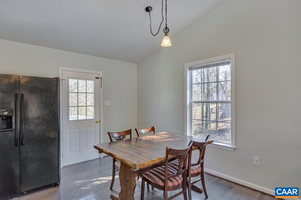 127 Larkspur Road Ruckersville, VA 22968 - Photo 11 of 29 a view of a dining room with furniture window and wooden floor