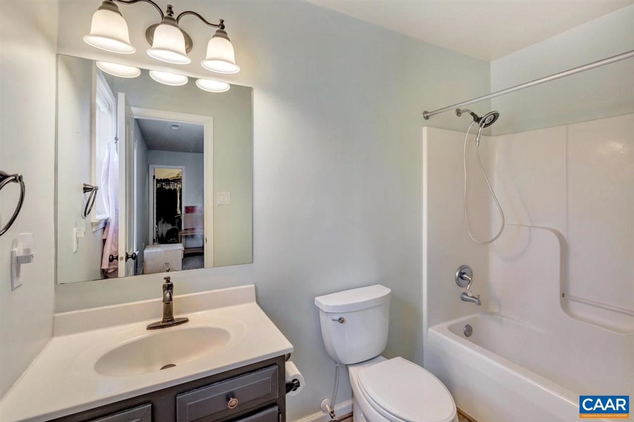 127 Larkspur Road Ruckersville, VA 22968 - Photo 15 of 29 a bathroom with a sink a toilet and shower