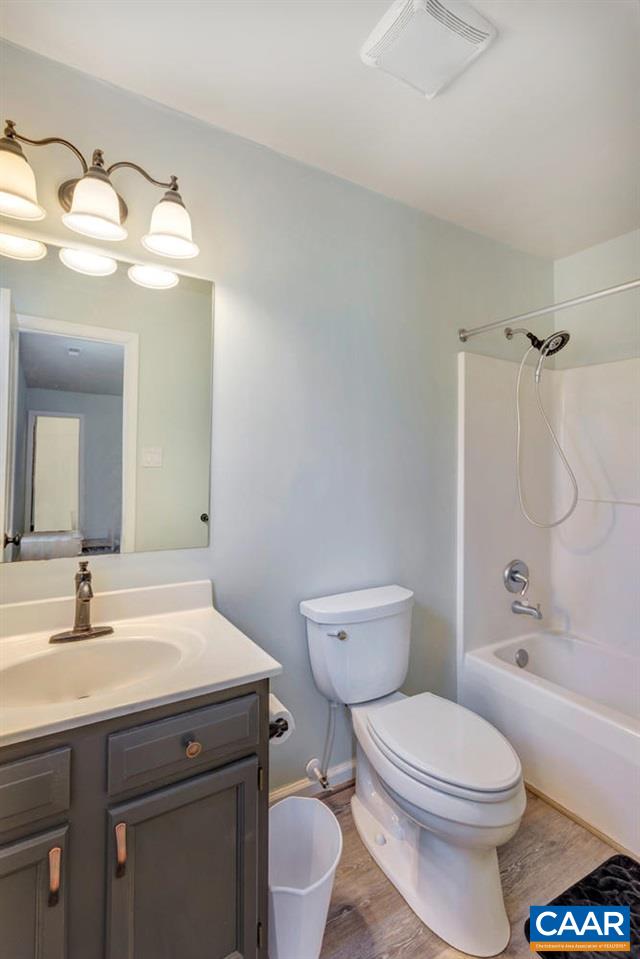 127 Larkspur Road Ruckersville, VA 22968 - Photo 16 of 29 a bathroom with a sink toilet vanity and shower