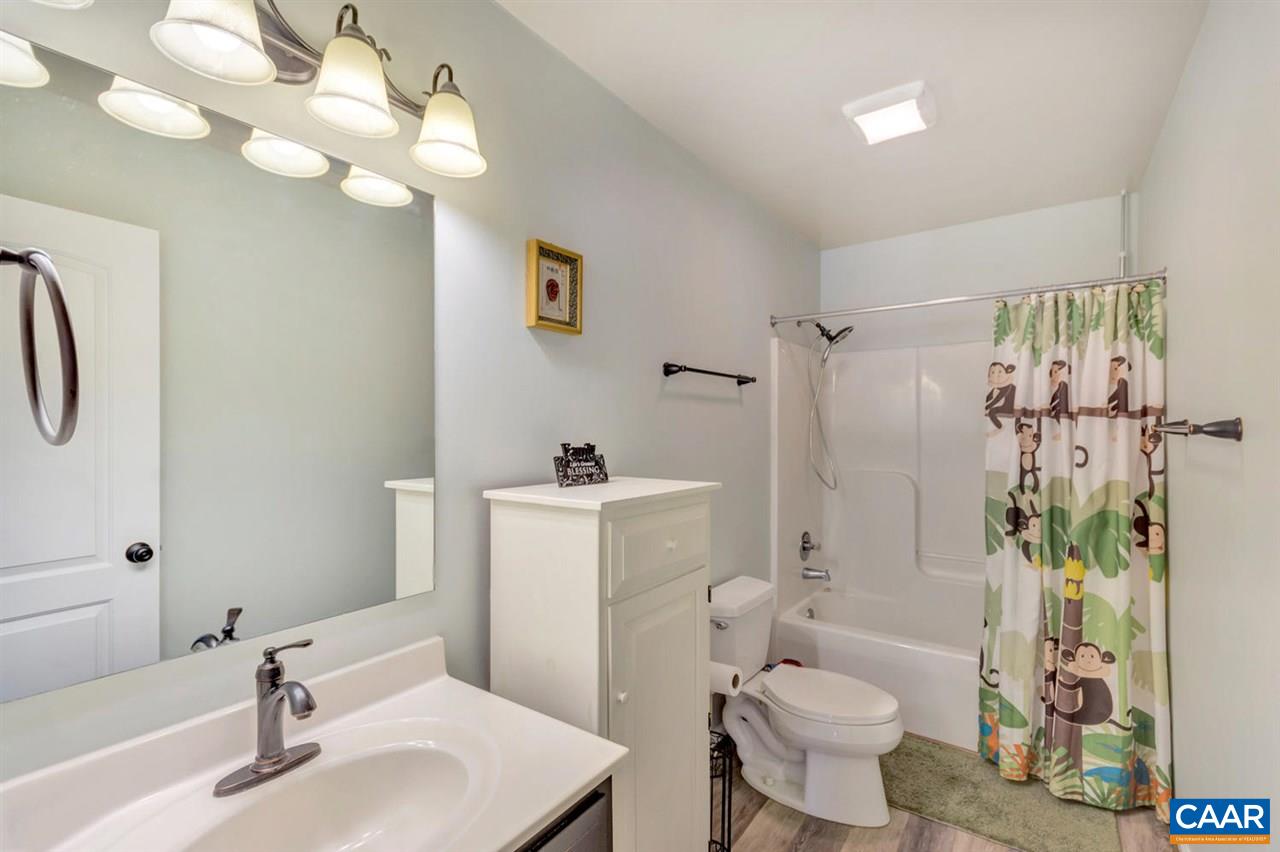 127 Larkspur Road Ruckersville, VA 22968 - Photo 20 of 29 a bathroom with a sink toilet and shower