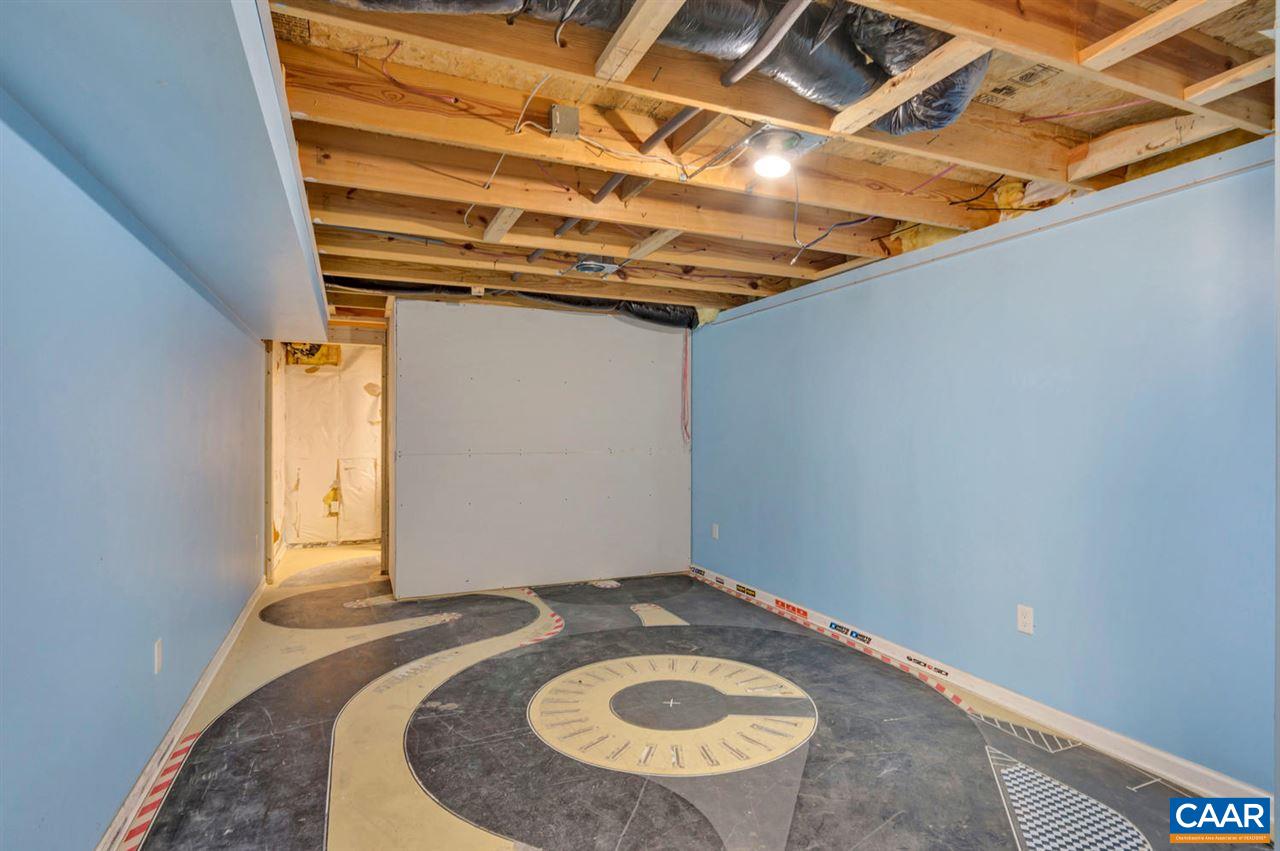 127 Larkspur Road Ruckersville, VA 22968 - Photo 23 of 29 a view of a room with a wooden bed