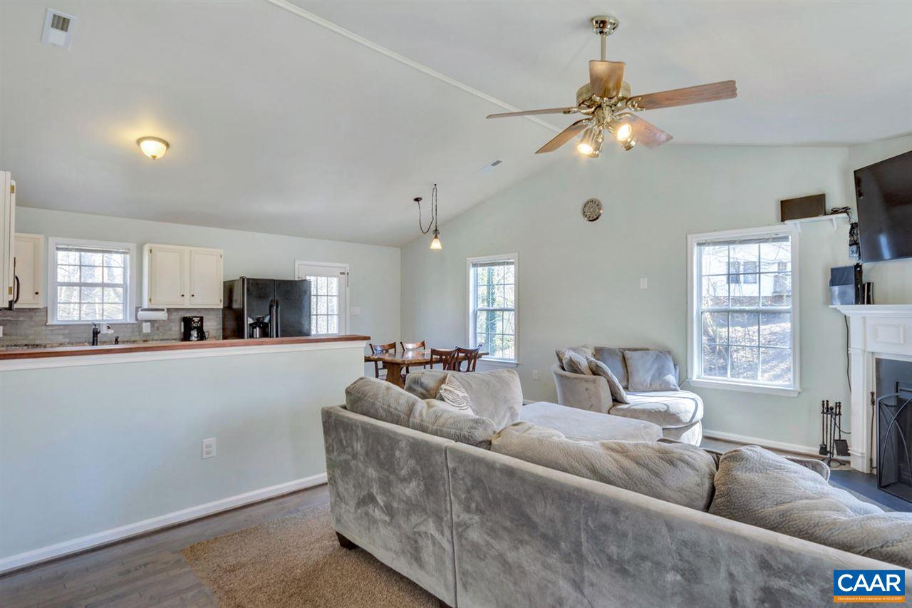 127 Larkspur Road Ruckersville, VA 22968 - Photo 6 of 29 a living room with furniture and a flat screen tv
