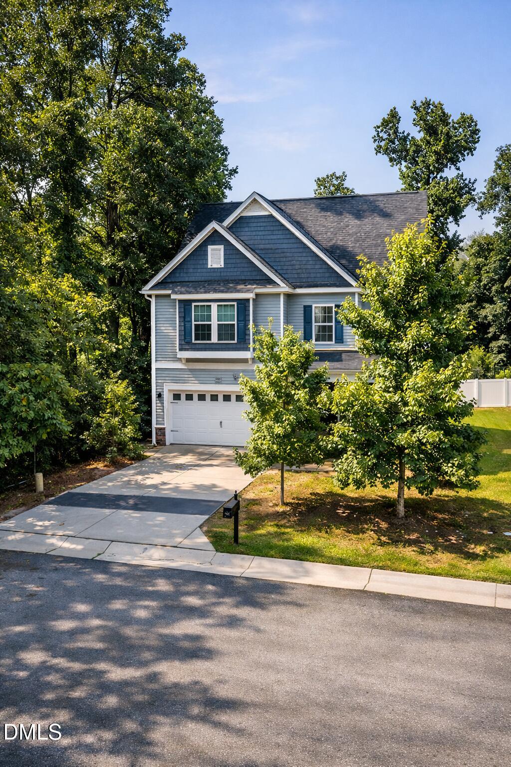 3401 Grosbeak Way Raleigh, NC 27616 - Photo 12 of 13 a front view of a house with a yard