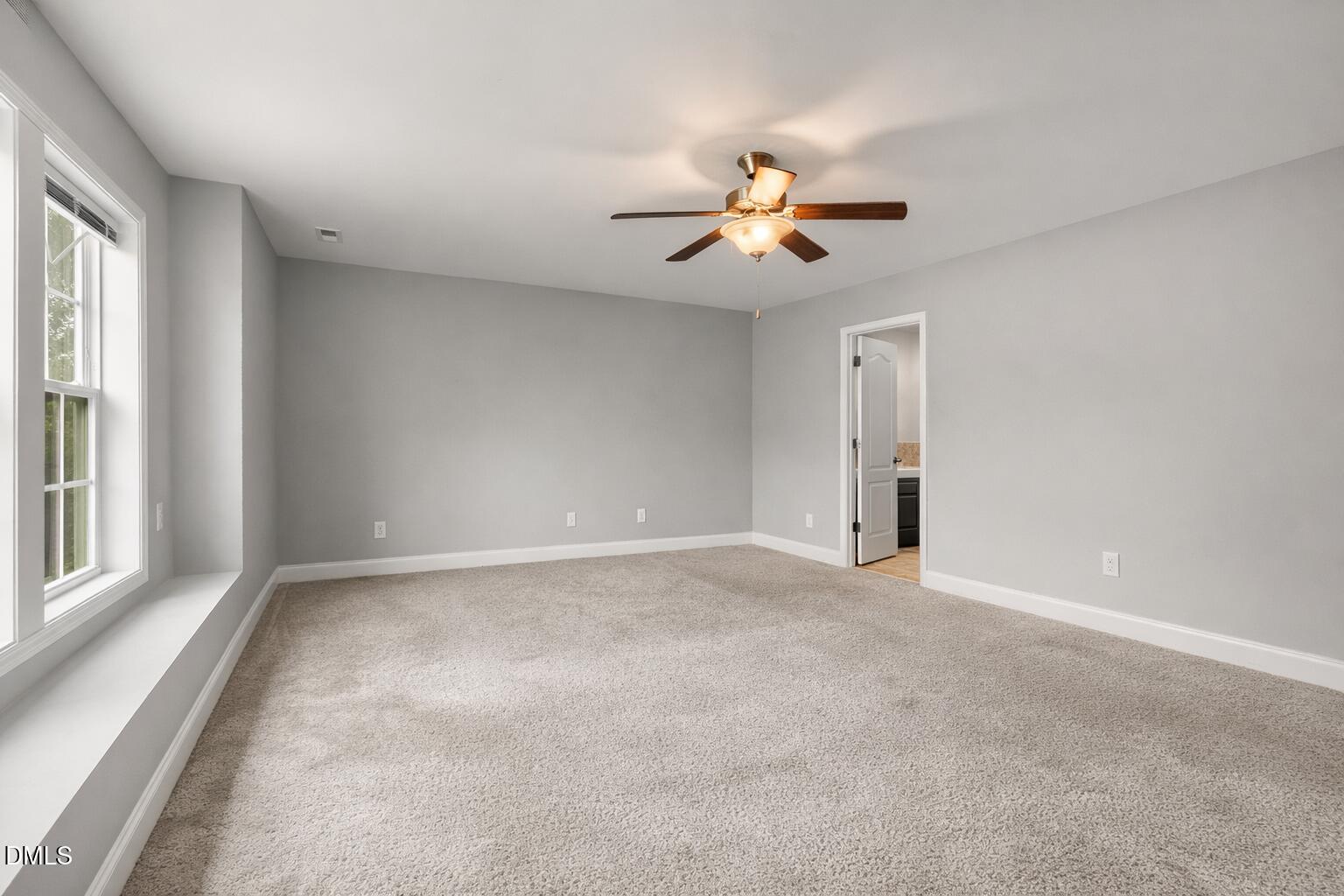 3401 Grosbeak Way Raleigh, NC 27616 - Photo 7 of 13 a view of an empty room with a window