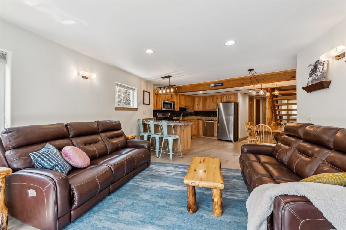 209 Miners Creek Road Frisco, CO 80443 - Photo 12 of 32 a living room with furniture and kitchen view