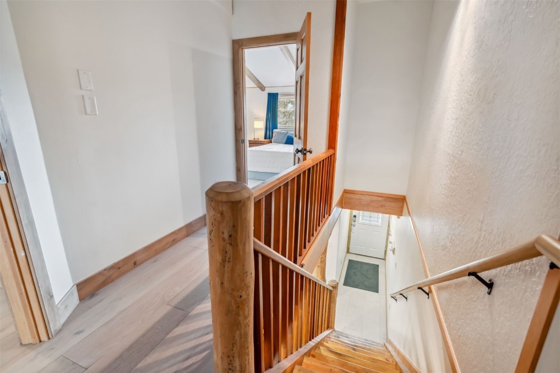 209 Miners Creek Road Frisco, CO 80443 - Photo 16 of 32 a view of staircase with wooden floor and white walls