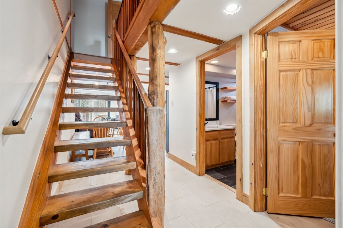 209 Miners Creek Road Frisco, CO 80443 - Photo 29 of 32 a view of a hallway with wooden floor and entryway