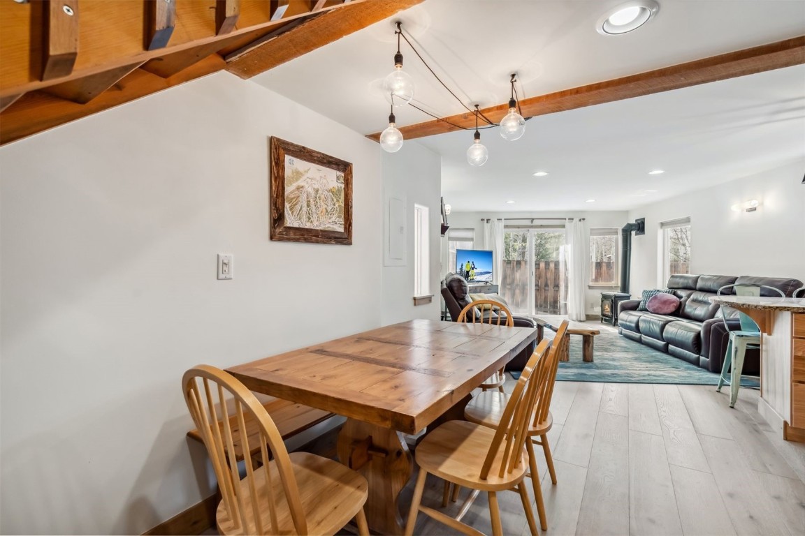 209 Miners Creek Road Frisco, CO 80443 - Photo 10 of 32 a view of a dining room with furniture and wooden floor