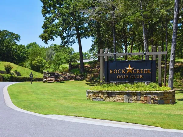 a view of a park with welcome board