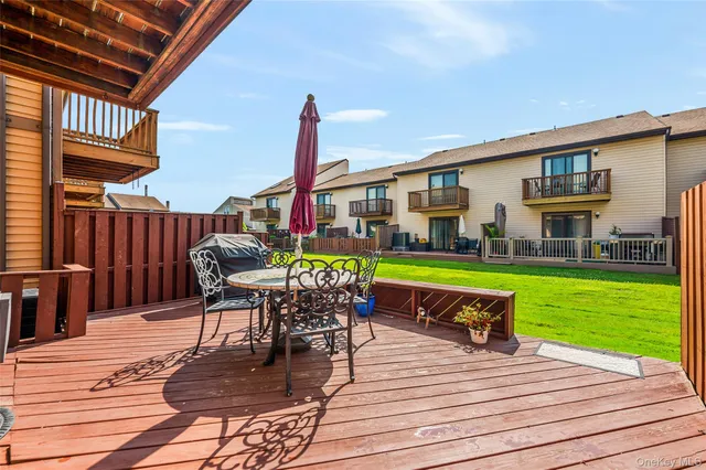 a view of a patio with a table and chairs