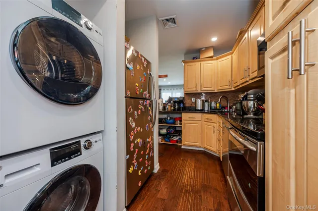 a kitchen with counter top space and stainless steel appliances
