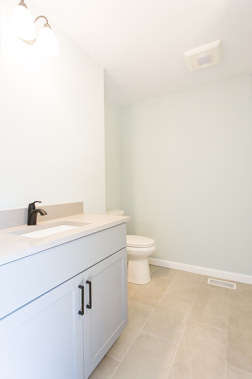 455 Cronin Road West Brookfield, MA 01585 - Photo 18 of 35 a bathroom with a sink a toilet and mirror
