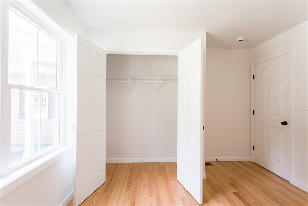 455 Cronin Road West Brookfield, MA 01585 - Photo 24 of 35 a view of hallway with a large window and wooden floor