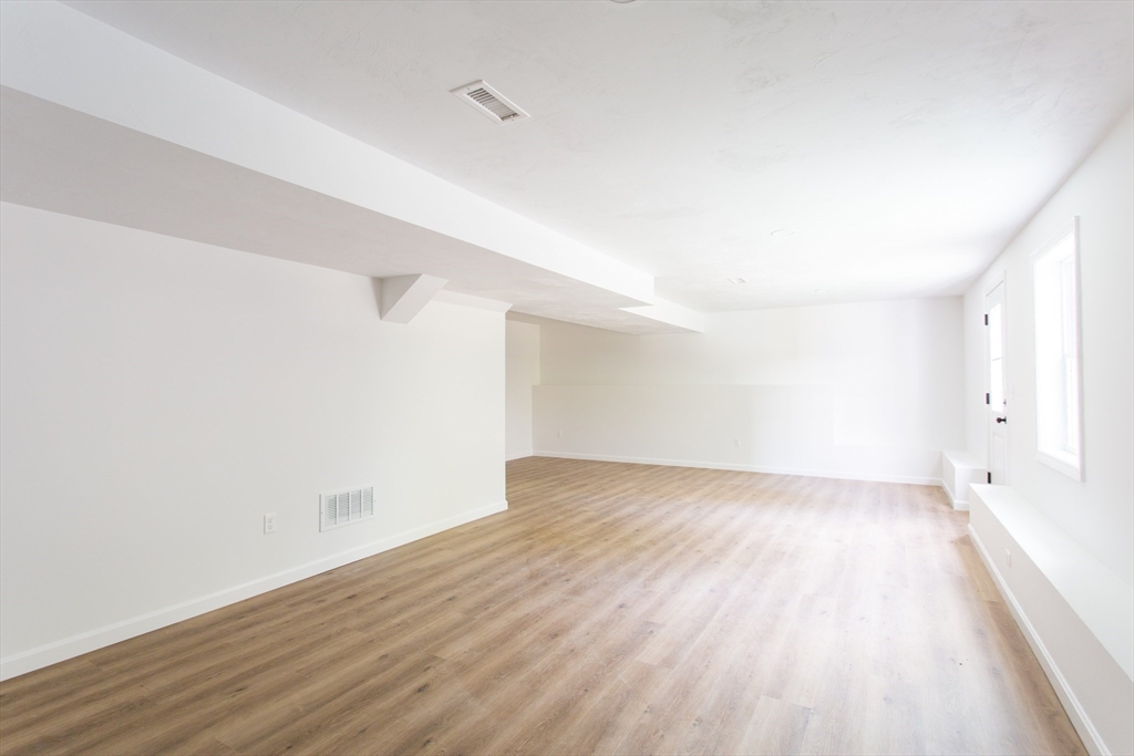455 Cronin Road West Brookfield, MA 01585 - Photo 28 of 35 a view of an empty room with wooden floor