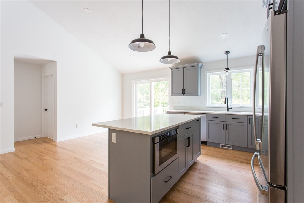 455 Cronin Road West Brookfield, MA 01585 - Photo 4 of 35 a kitchen with a sink stove and refrigerator