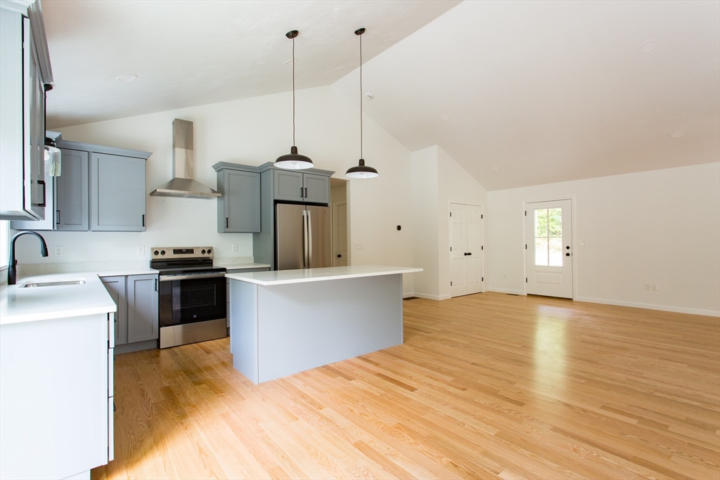 455 Cronin Road West Brookfield, MA 01585 - Photo 5 of 35 a kitchen with stainless steel appliances granite countertop a sink a stove and a wooden floors