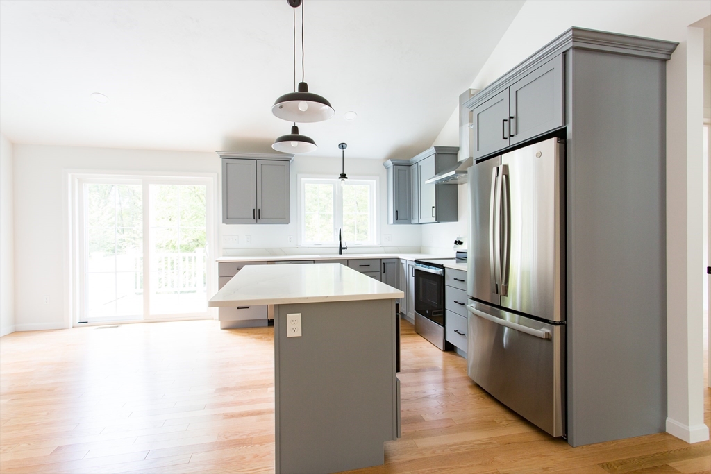 455 Cronin Road West Brookfield, MA 01585 - Photo 6 of 35 a kitchen with stainless steel appliances granite countertop a refrigerator a sink and a stove