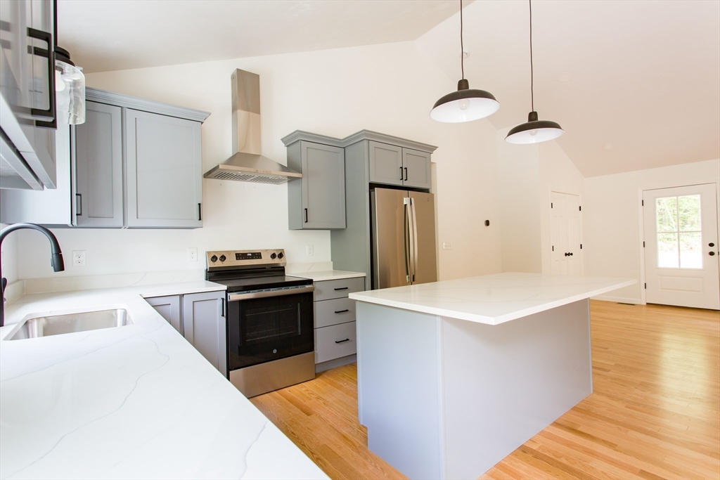 455 Cronin Road West Brookfield, MA 01585 - Photo 7 of 35 a kitchen with stainless steel appliances granite countertop a sink stove and refrigerator