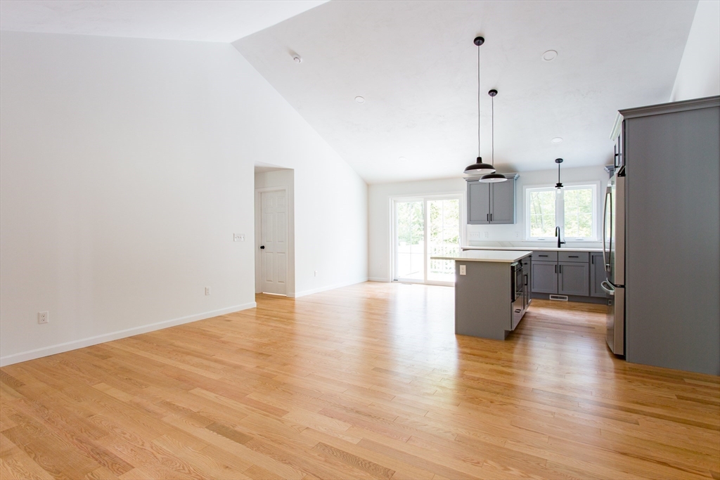 455 Cronin Road West Brookfield, MA 01585 - Photo 9 of 35 a view of a kitchen with a sink cabinets and wooden floor