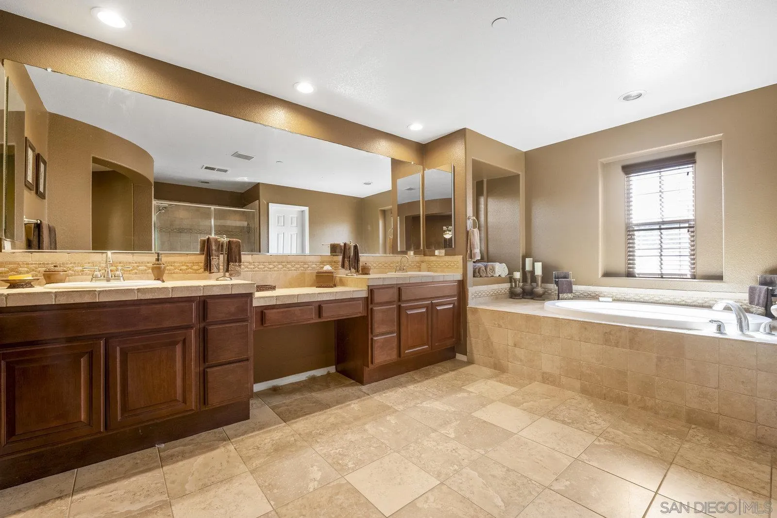 5545 Nanday Court Oceanside, CA 92057 - Photo 26 of 38 a large bathroom with a large tub and sink