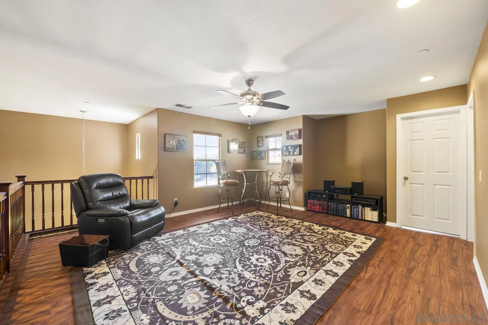 5545 Nanday Court Oceanside, CA 92057 - Photo 29 of 38 a living room with furniture and a wooden floor