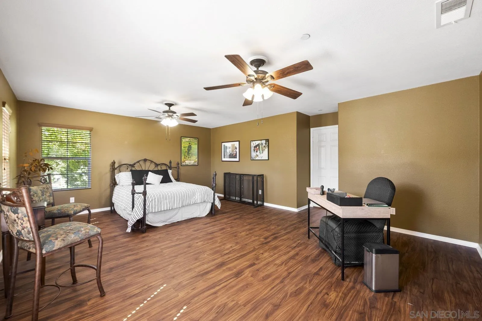 5545 Nanday Court Oceanside, CA 92057 - Photo 30 of 38 a living room with furniture and a wooden floor