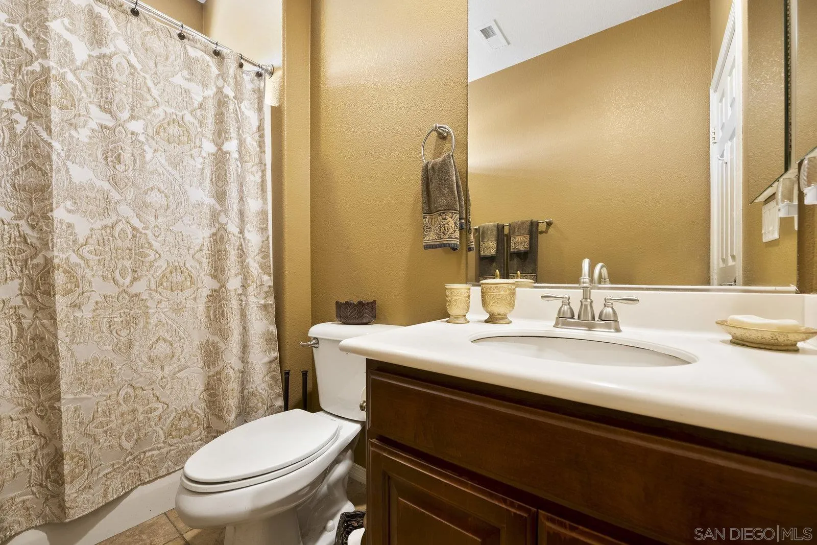 5545 Nanday Court Oceanside, CA 92057 - Photo 35 of 38 a bathroom with a sink and a mirror