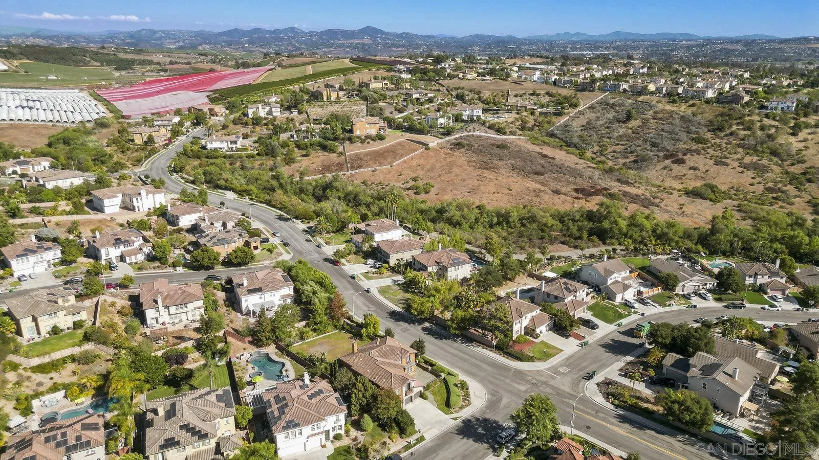5545 Nanday Court Oceanside, CA 92057 - Photo 38 of 38 an aerial view of residential houses with outdoor space and trees