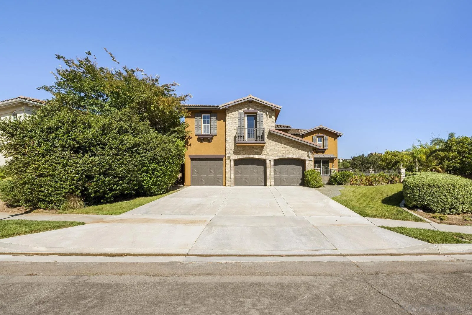 5545 Nanday Court Oceanside, CA 92057 - Photo 5 of 38 a front view of a house with a yard