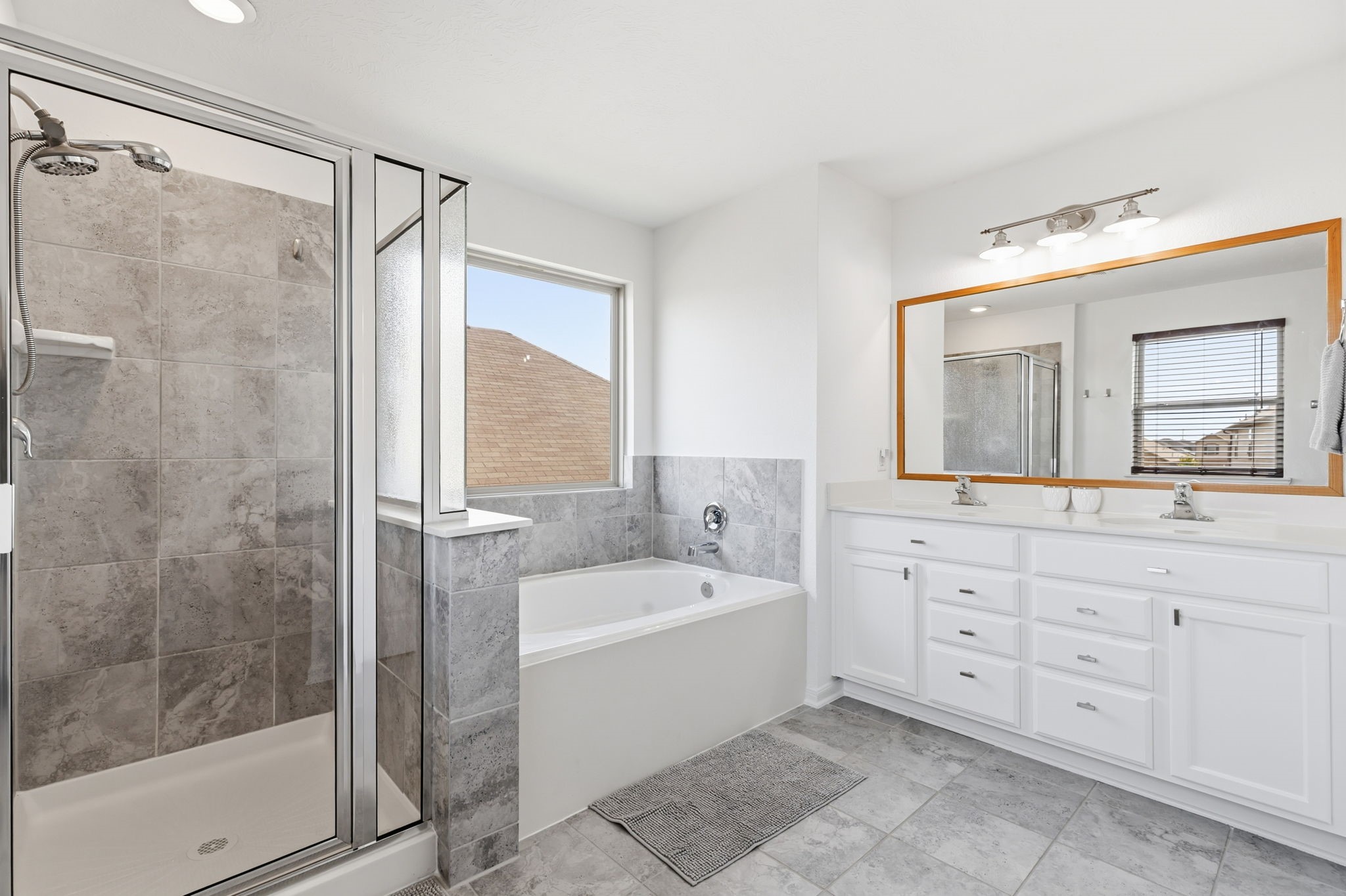 5127 Avondale Rise Street Katy, TX 77493 - Photo 26 of 47 a bathroom with a bathtub shower sink mirror and toilet