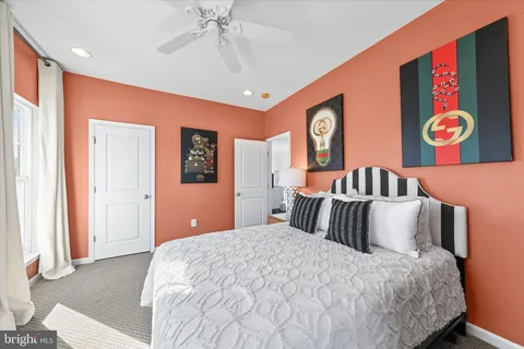 a bedroom with a bed and a lamp