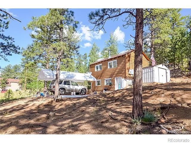 110 Jones Road Bailey, CO 80421 - Photo 3 of 28 a view of a house with a yard