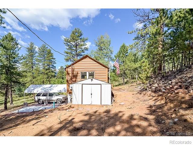 110 Jones Road Bailey, CO 80421 - Photo 4 of 28 a view of a house with a yard
