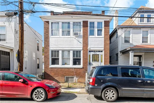 a front view of a house with parking