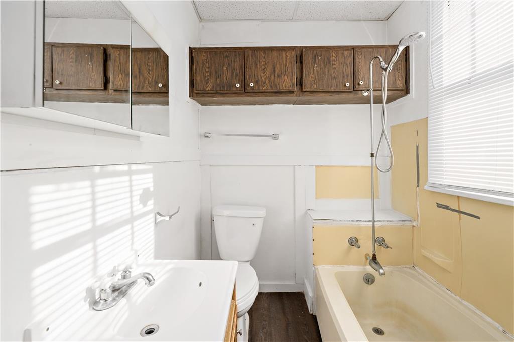 1210 Holmes Street McKees Rocks, PA 15136 - Photo 11 of 44 a bathroom with a sink a toilet and shower