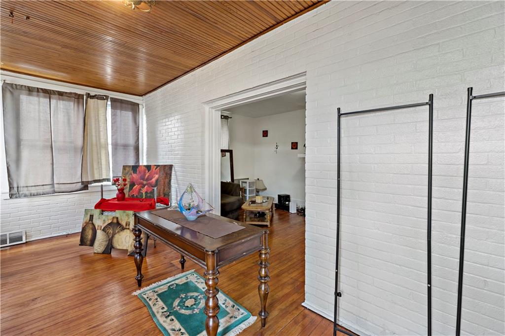 1210 Holmes Street McKees Rocks, PA 15136 - Photo 16 of 44 a living room with furniture and wooden floor
