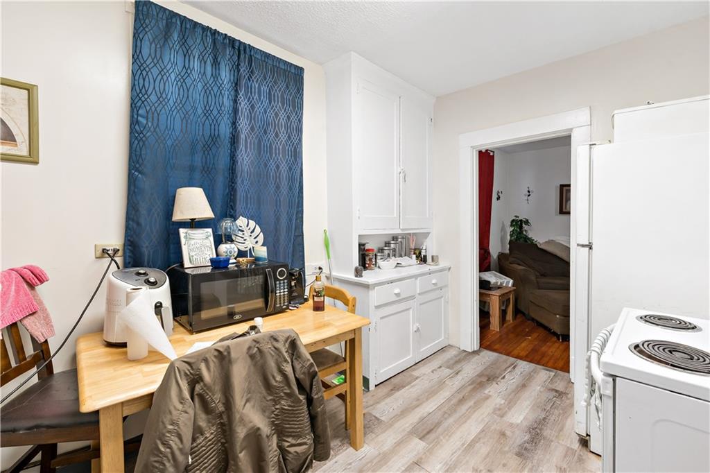 1210 Holmes Street McKees Rocks, PA 15136 - Photo 18 of 44 a bed room with a bed and a tv