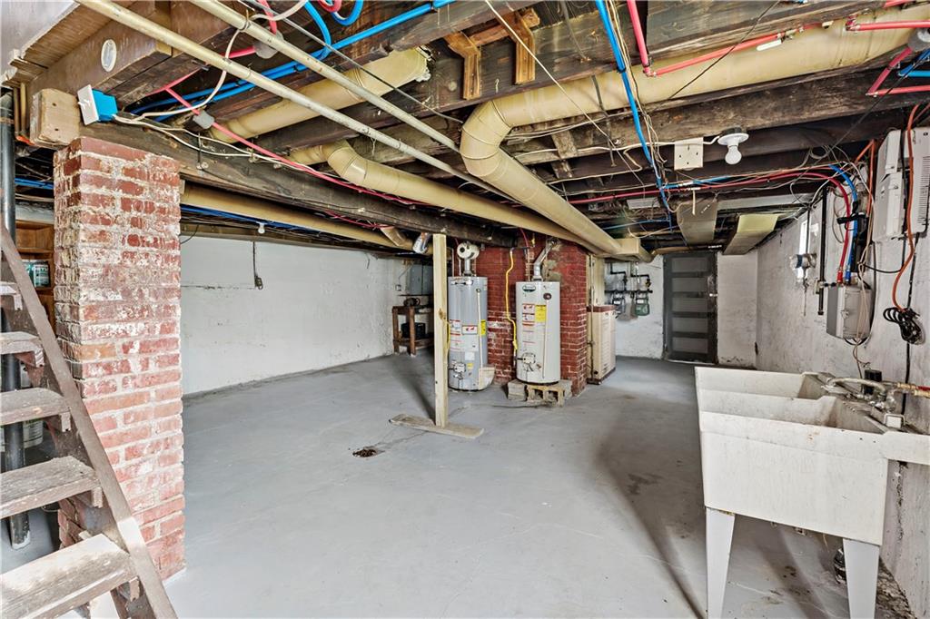 1210 Holmes Street McKees Rocks, PA 15136 - Photo 23 of 44 a view of a garage with wooden floor