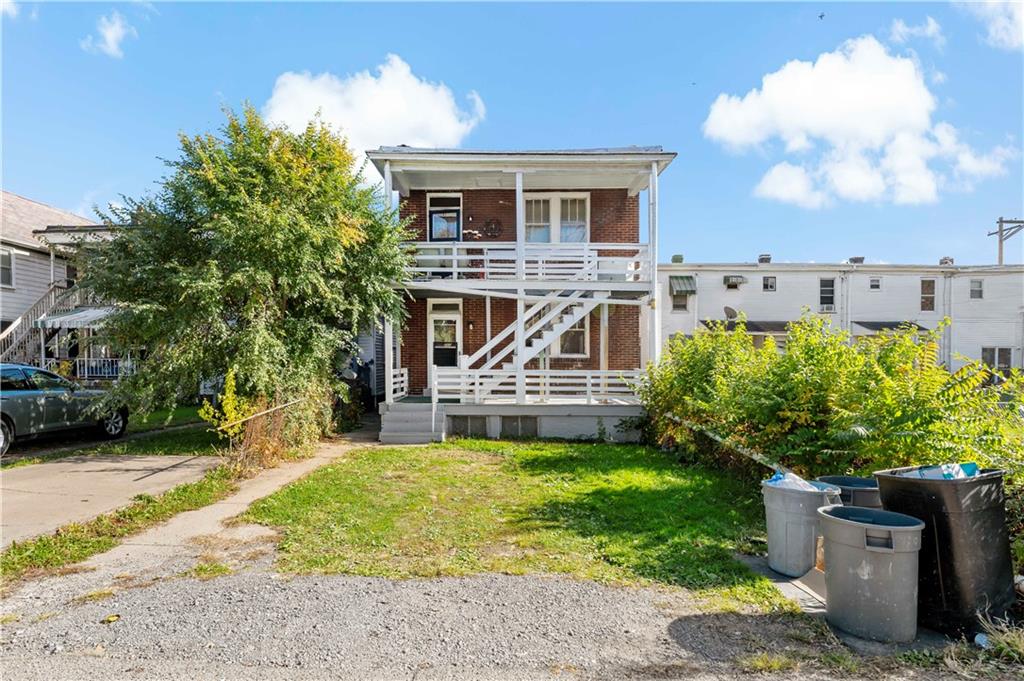 1210 Holmes Street McKees Rocks, PA 15136 - Photo 26 of 44 a view of a house with a garden